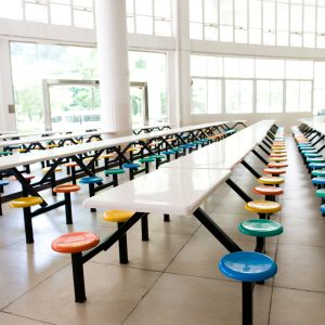 Clean,School,Cafeteria,With,Many,Empty,Seats,And,Tables.
